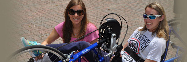 Women with recumbent bike.